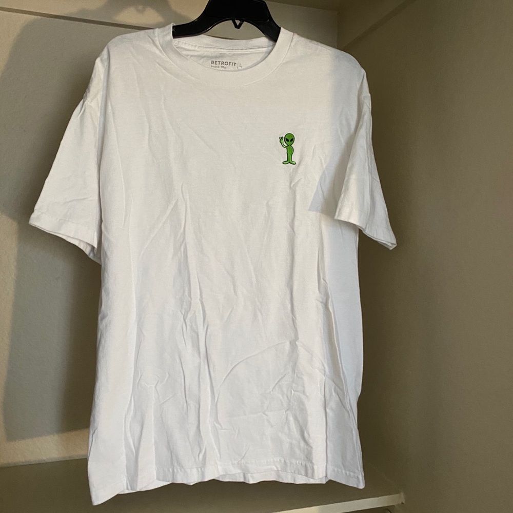 white t-shirt. alien logo on front.